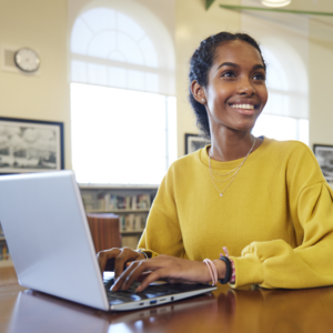 teenage girl using a laptop